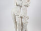 statue of a woman holding a basket of flowers