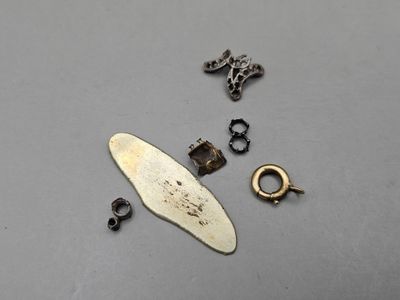 a small piece of metal that is laying on a table