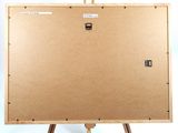 an easel with a piece of cardboard on top of it on a white background