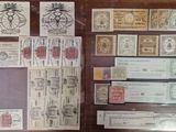 a lot of stamps on display in a glass case