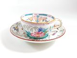 a tea cup and saucer on a saucer