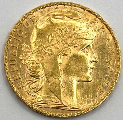 l'image d'une pièce d'or sur laquelle figure une tête de femme