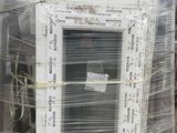 a lot of old windows sitting on a pallet