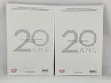 a pair of two white books sitting on top of a table