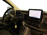 a car dashboard with a monitor and a steering wheel