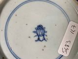 a blue and white plate with a bird on it