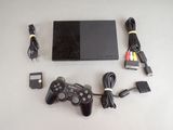 a video game console and a charger on a table