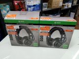 two boxes of headphones are sitting on a table in a store