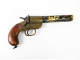 an old gun with a wooden handle on a white surface