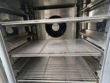 an open oven with a lot of food inside of it