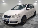 a picture of a white car parked in a garage