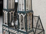 a bird cage that has two birds inside of it
