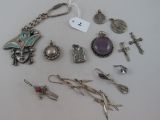 a lot of jewelry that is laying out on the table