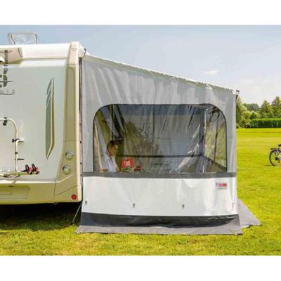 an image of a camper trailer parked in a grassy field