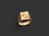 a gold ring with a skull and crossbone on it