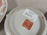 a lot of cups and saucers that are on the table