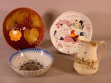 three bowls and a pitcher sitting on a table