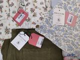 a lot of clothes that are on a table