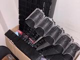 a cardboard box with a bunch of black umbrellas in it