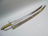 pair of two swords on a white surface with one sword in the foreground