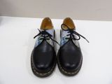 dr martensock shoes with floral print on them on a white surface