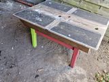 a bench made out of wood and a table made out of old boards