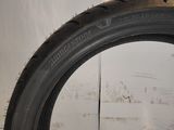 a close up of a tire tire on a white wall