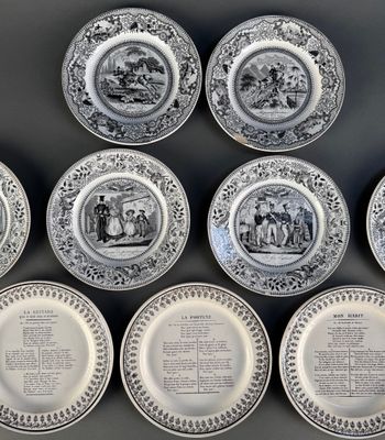 six black and white plates with different designs on them on a table