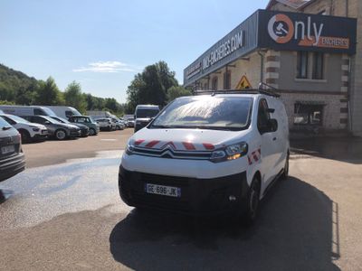 a white van that is parked in front of a building