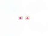 une paire de boucles d'oreilles en saphir rose et diamants sur fond blanc