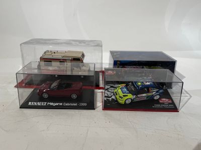 two toy cars are in a display case on a white surface