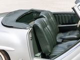 a silver car with a black leather seat in the back
