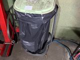 an image of a trash can in a garage