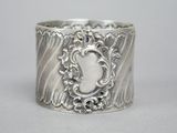 a close up of a silver ring with a picture on it
