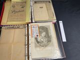 several old books sitting on top of each other on a table