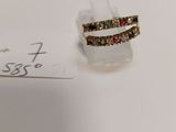 a small piece of jewelry sitting on top of a piece of paper