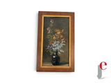 a painting of flowers in a vase on the wall