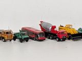 a lot of toy trains that are lined up on the table
