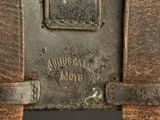 a close up of a piece of luggage that is rusted