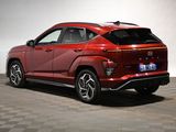 a red 2020 hyundai kona parked in a room with a checkered floor