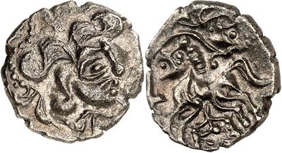a silver coin with an image of a man ' s face on it