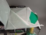 a white umbrella sitting on top of a table next to other items