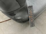 a measuring tape on the seat of a scooter