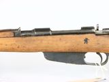 an old rifle with a wooden barrel on a white background