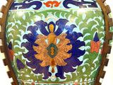 a large vase with a floral design on it