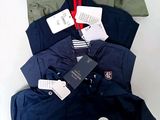 a pile of men ' s clothing sitting on a table