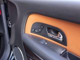 a close up of a door handle in a car