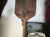 a wooden spatula next to a sink in a room