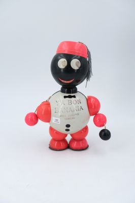 a red and black robot toy with a coin in its hand