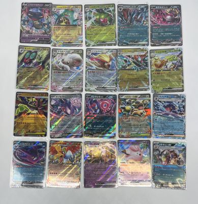 a bunch of pokemon cards sitting on top of a table